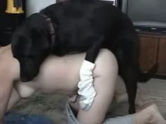 A nude bitch is being blasted by a big black dog xxx.